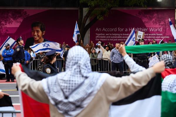 Pro-Israel supporters confront pro-Palestine protestors at a rally near the Consulate General of Israel after Hamas attacked Israel in the ongoing conflict in the Middle East